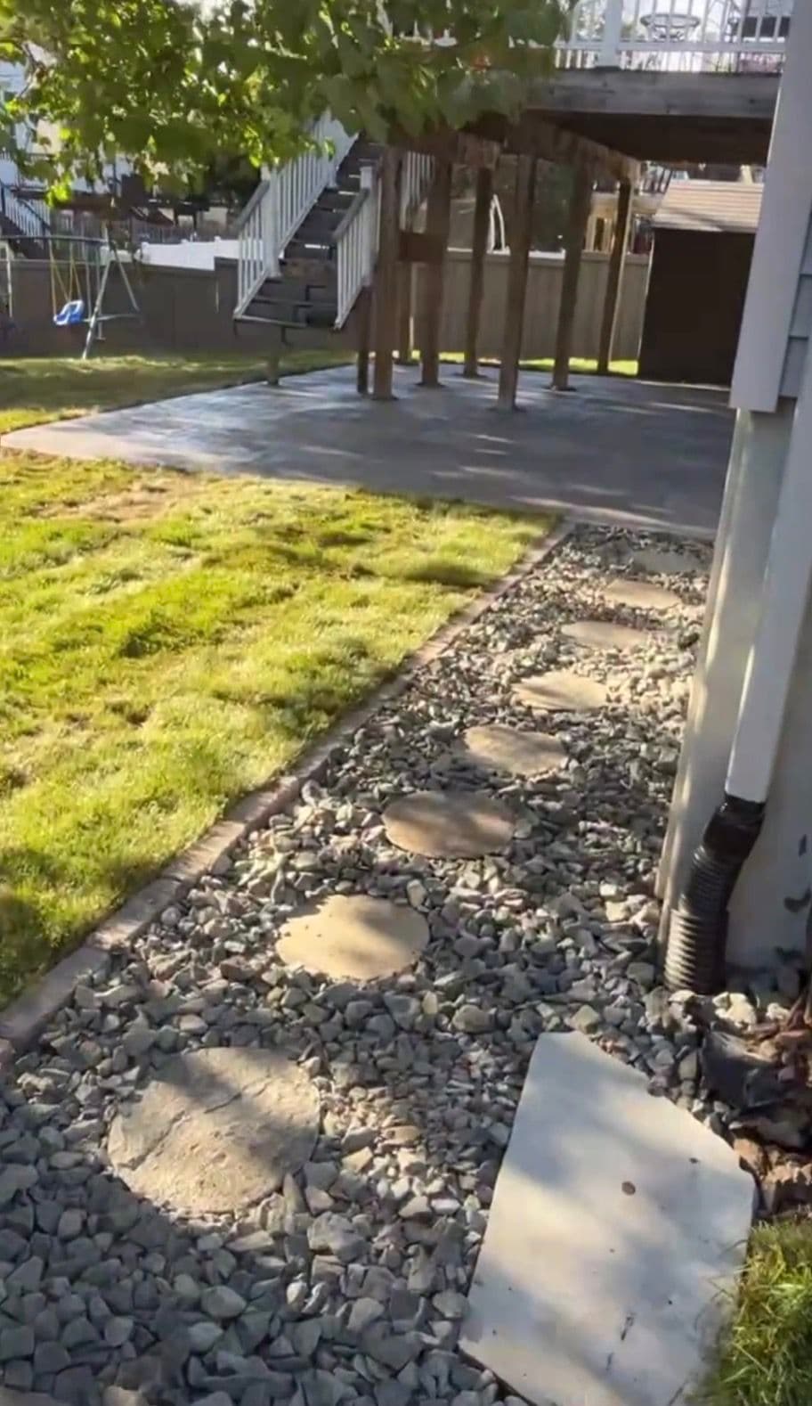 Muddy Backyard Gets Stamped Concrete, Fresh Sod, and Proper Drainage image