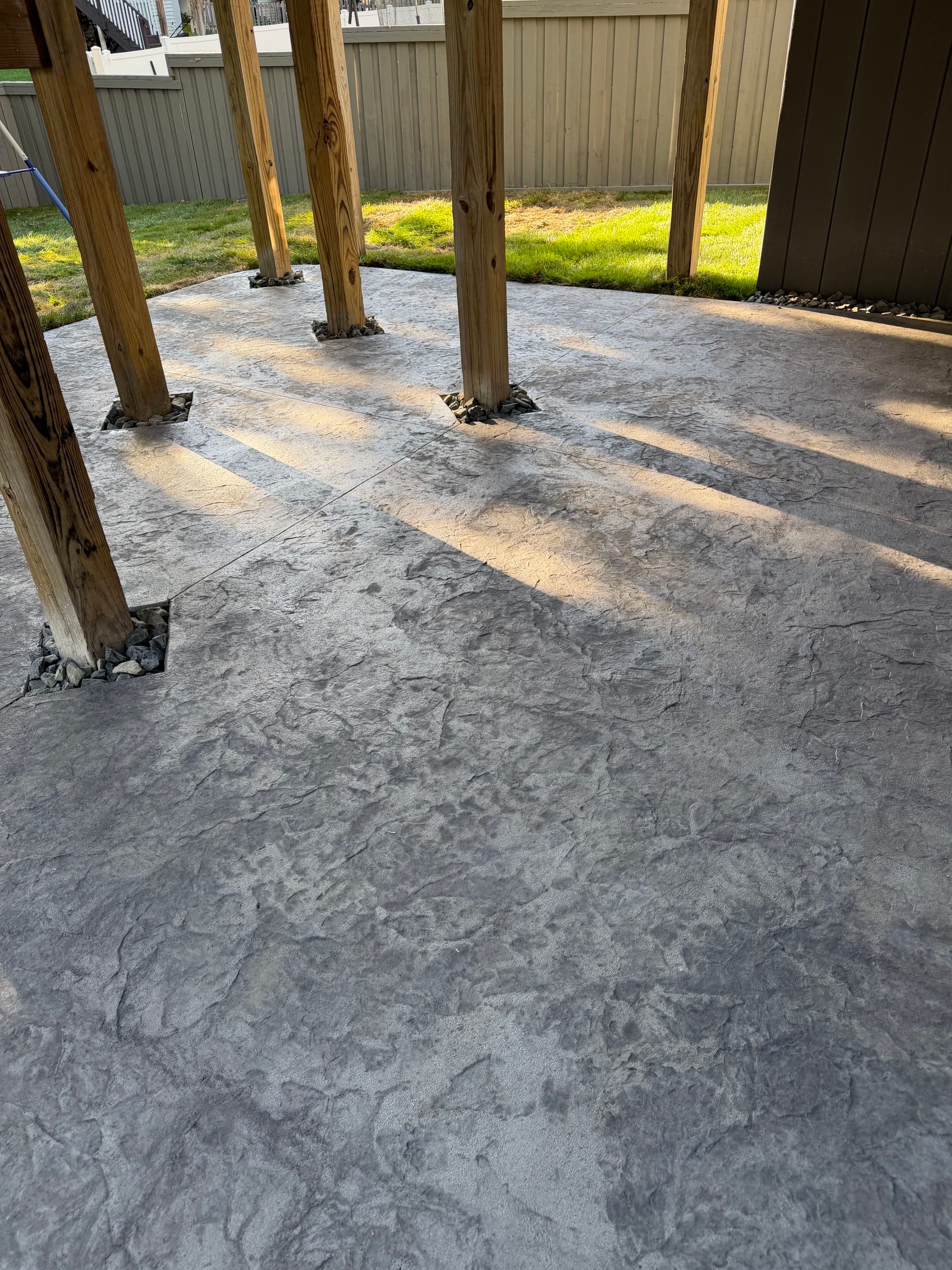 Gallery photos for Muddy Backyard Gets Stamped Concrete, Fresh Sod, and Proper Drainage: Image #2