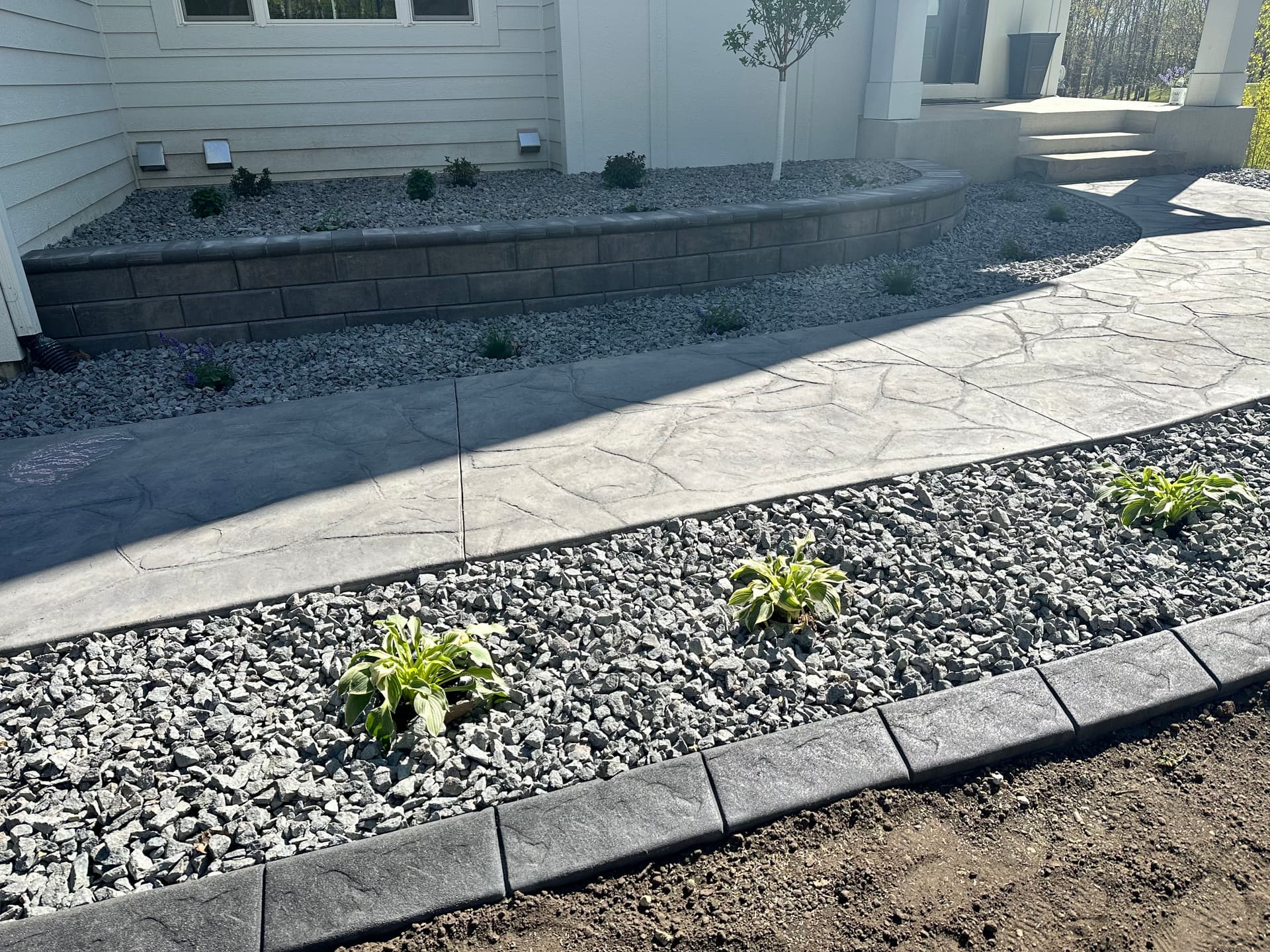 Gallery photos for Muddy Slope to Stamped Concrete Patio with Fireplace in Prior Lake: Image #1